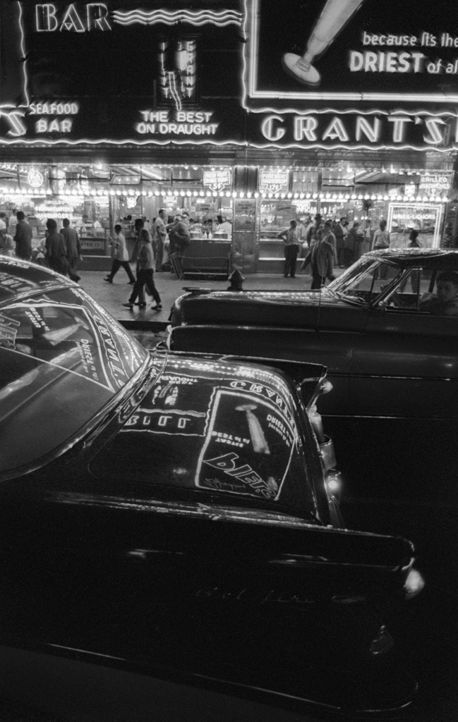 Times Square Saturday night, 1957  Here Grant's cafeteria is shown across the street and reflected on the car