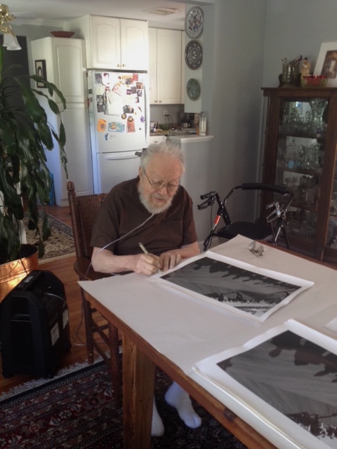 Harold signing prints, June 19, 2015