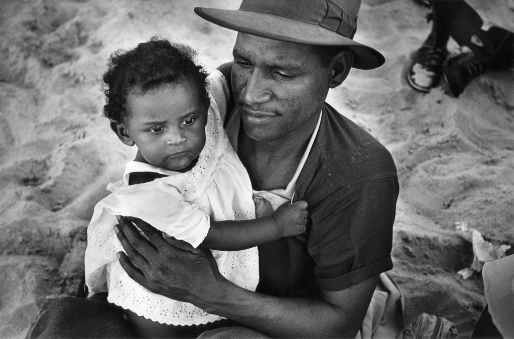 Haitian man with daughter, Coney Island, 1950